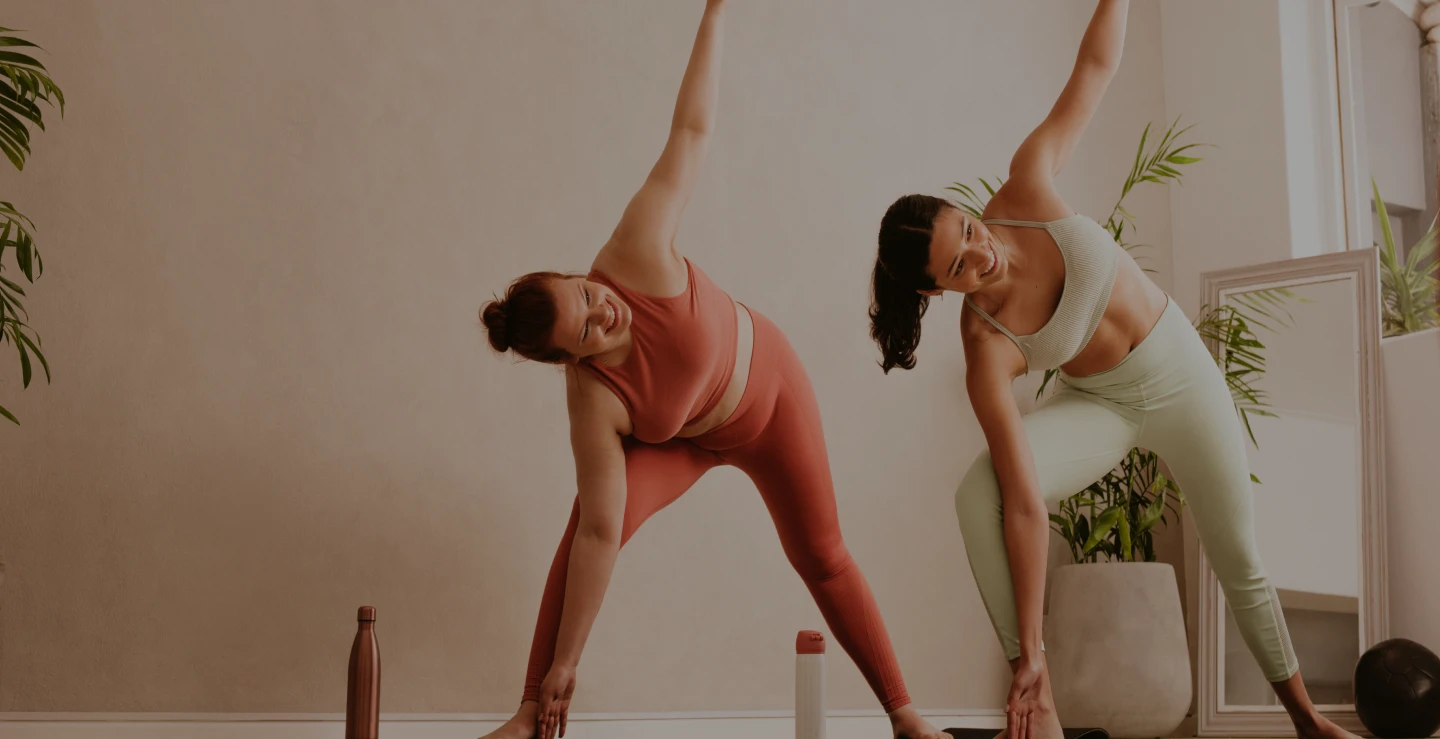 Women stretching during yoga class – Ditesheim Cosmetic Surgery